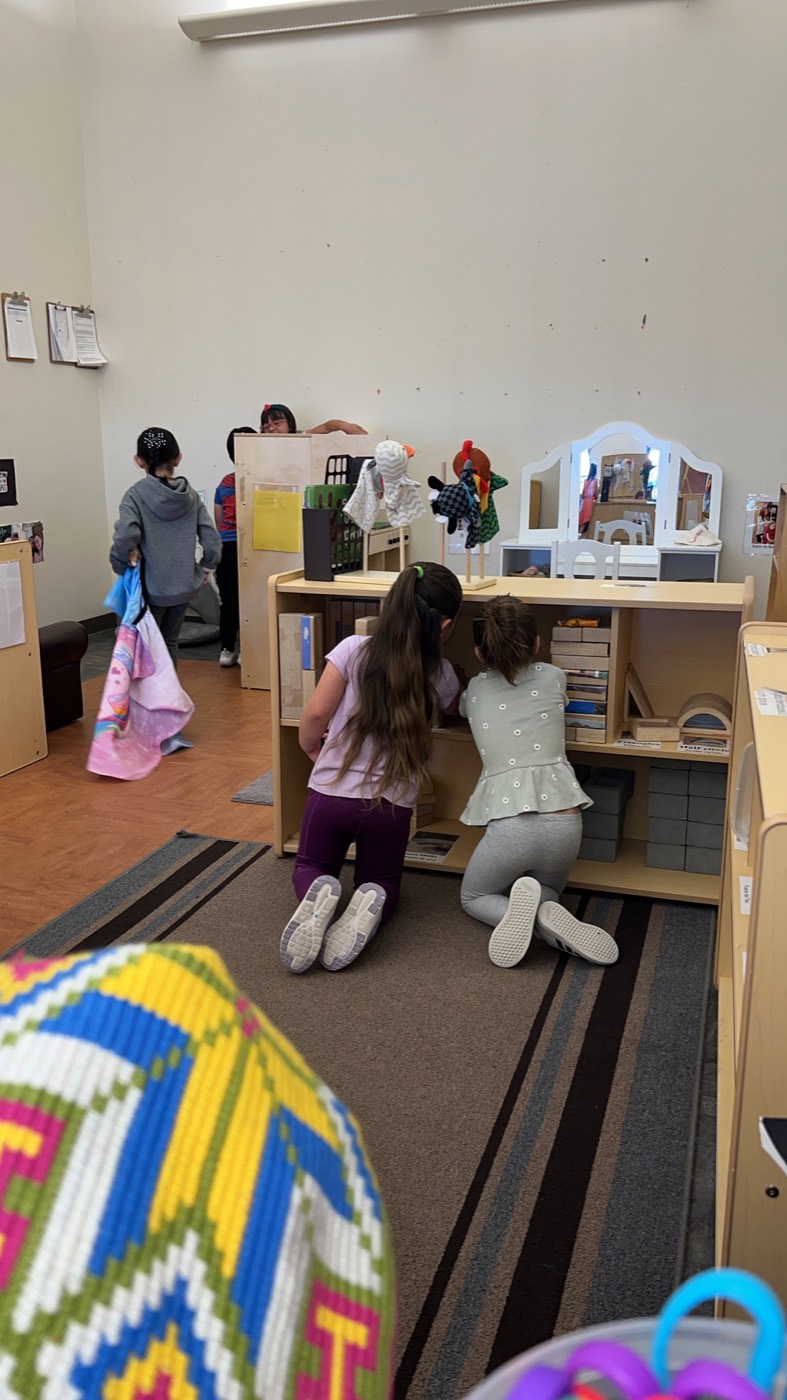 Children engaged in imaginative classroom play at Milestone Center for Children.