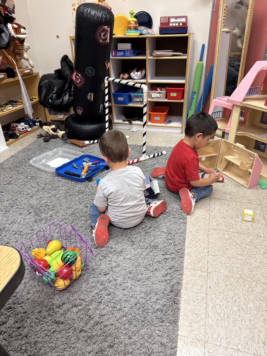 Children playing and learning with toys in a Milestone Center for Children classroom.